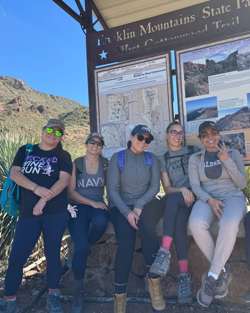 Photo of Healthy Living hiking class smiling for a photo while on a hike