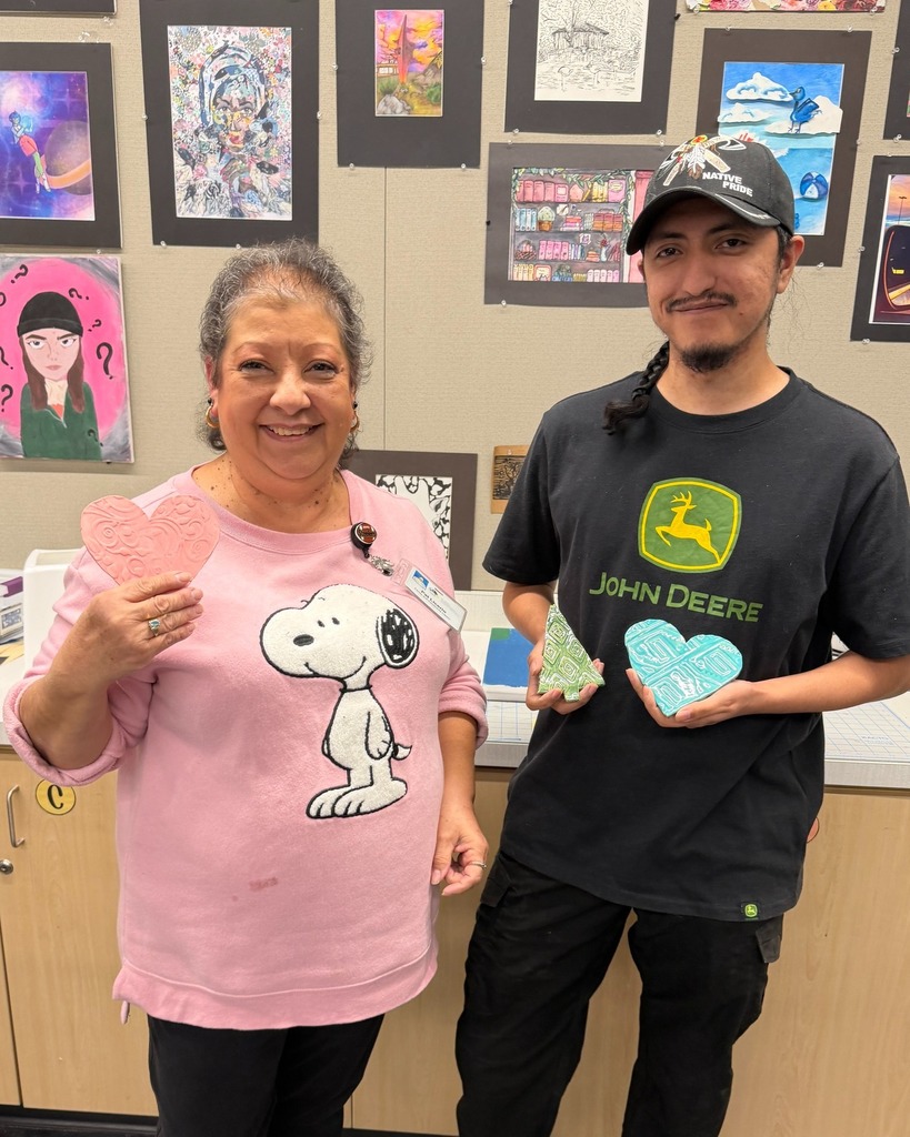 Photo of Healthy Living ceramics class participants showing off their ceramics