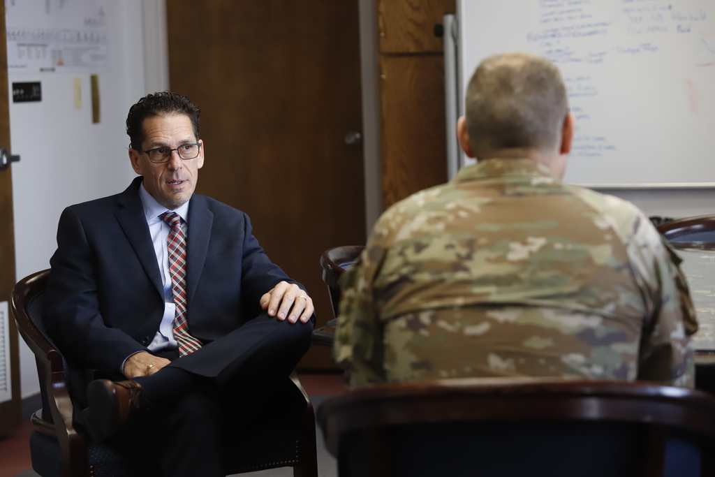 El Paso ISD Superintendent Dr. Brian Lusk and Garrison Commander Col. Michael Soyka talking in an office