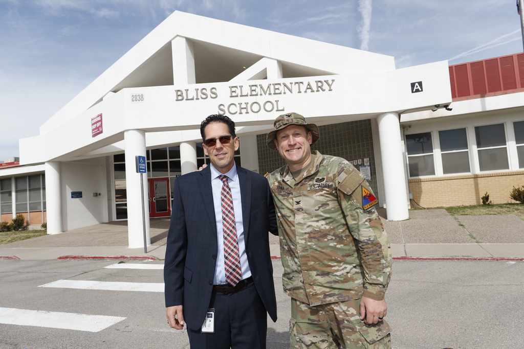 El Paso ISD Superintendent Dr. Brian Lusk and Garrison Commander Col. Michael Soyka smile for a photo in front of Bliss Elementary School