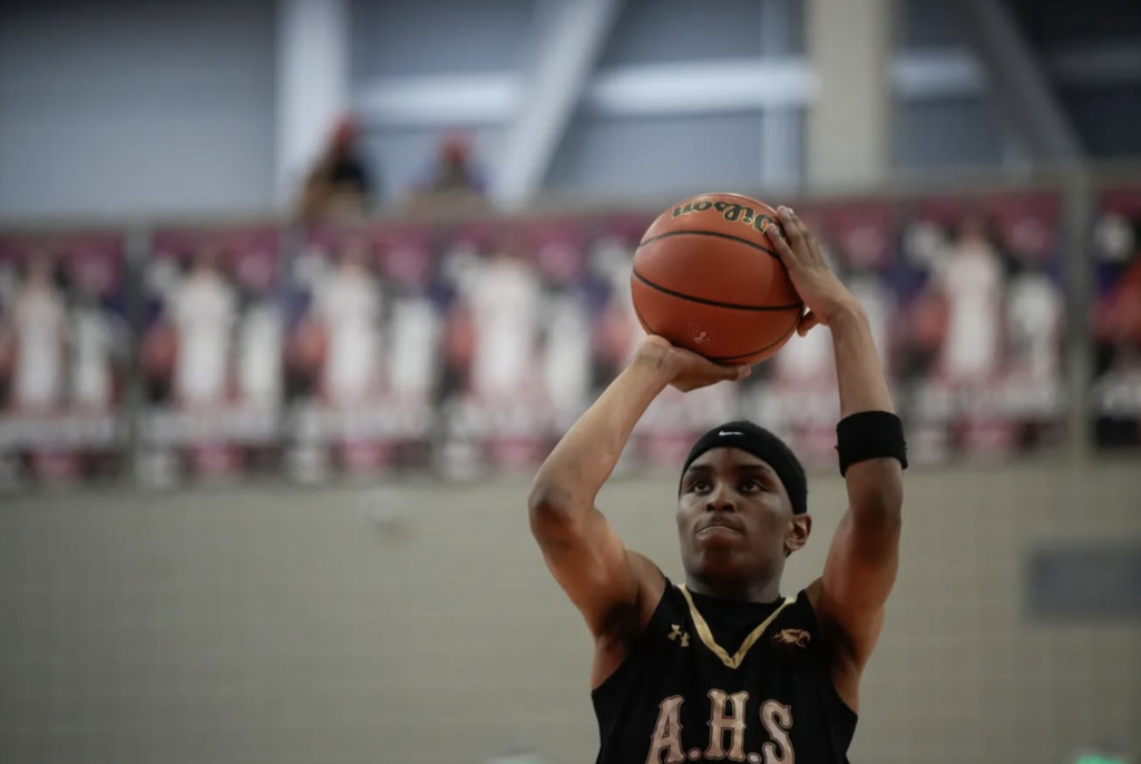 Andress High School basketball player making a shot
