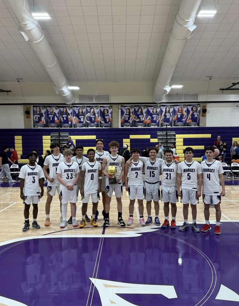 Burges boys basketball team takes group photo with bi-district trophy