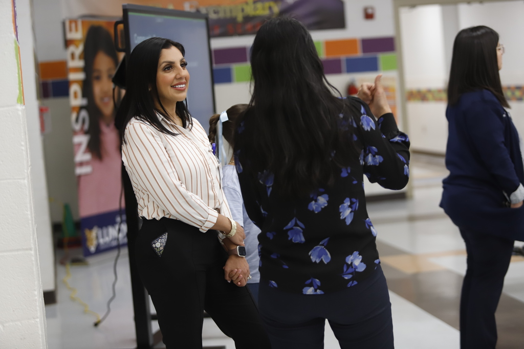 Trustee Valerie Ganelon Beals talks to a community member