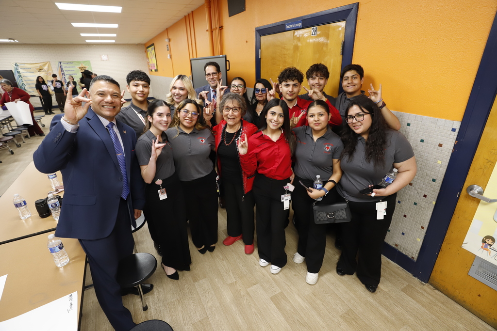 Jefferson Silva High School principal and students and staff smile for a group photo with Superintendent Dr. Brian Lusk