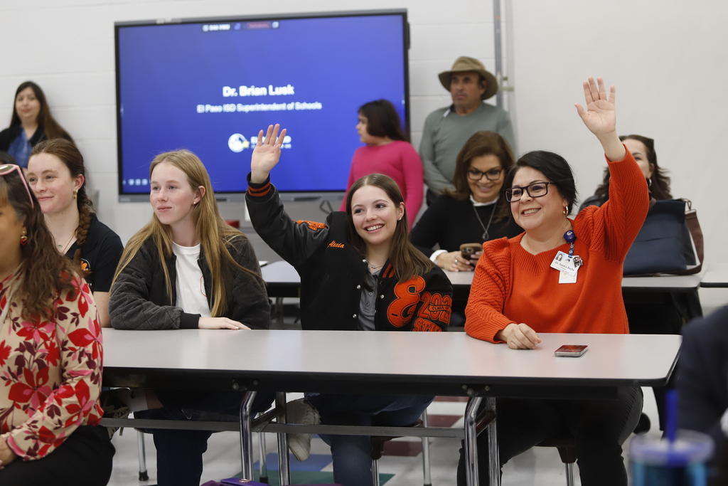 El Paso High student and Principal raise hands while smiling