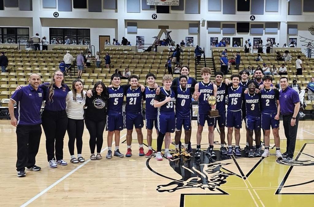 Burges High School boys basketball team takes group photo with their Regional Semi-Final Champions trophy