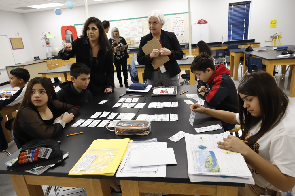 Feeder pattern principals help students during class