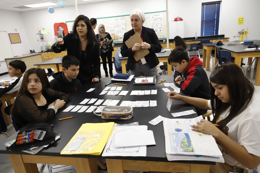 Feeder pattern principals help students during class