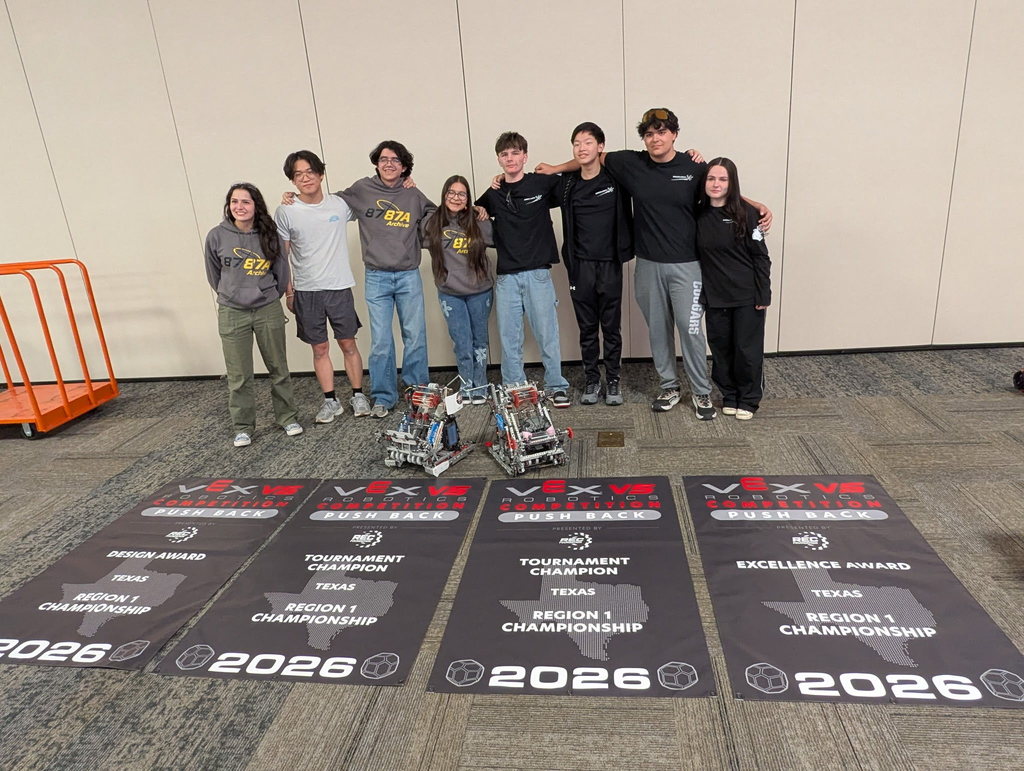 Franklin High School Robotics team takes a group photo with winning banners