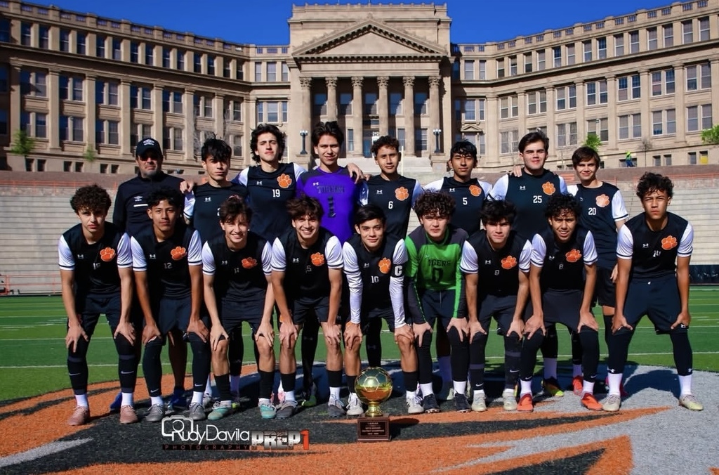 El Paso High School Boys Soccer Team takes group photo with their District Champions Trophy