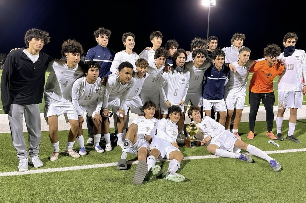 Coronado High School Boys Soccer Team takes group photo with their District Champions Trophy
