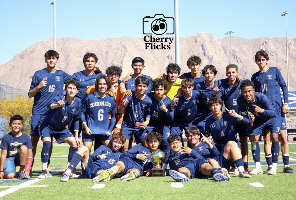 Group photo of the Coronado High School Boys Soccer team with their Bi-District Champions Trophy