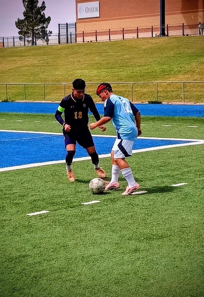 Burges High School varsity boys soccer player action shot during match