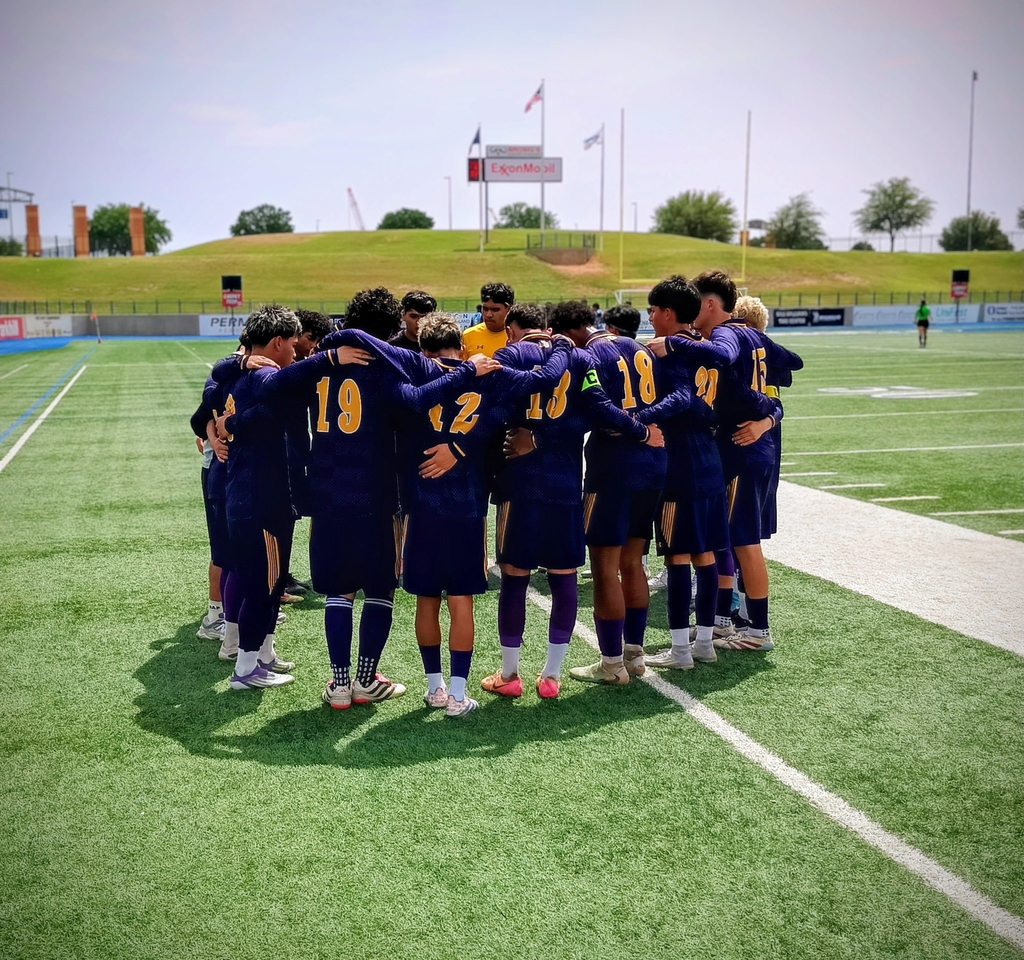 Burges High School varsity boys soccer team has a group huddle during match