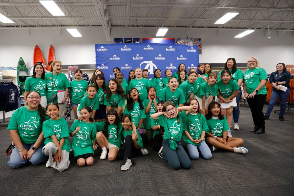Mesita Elementary students who are part of Girls on the Run take group photo at Academy Sports + Outdoors