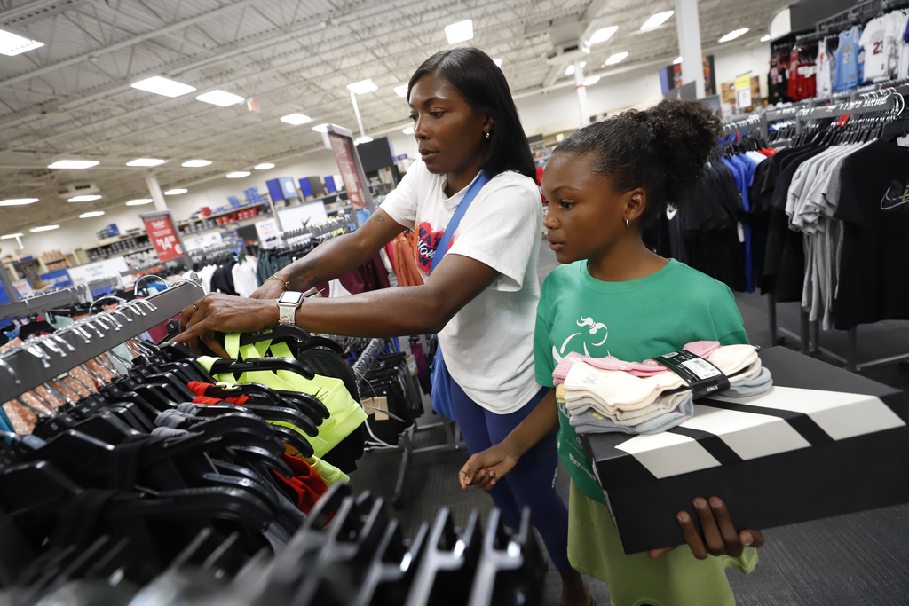 Mesita Elementary student who is part of Girls on the Run shops with parent at Academy Sports + Outdoors
