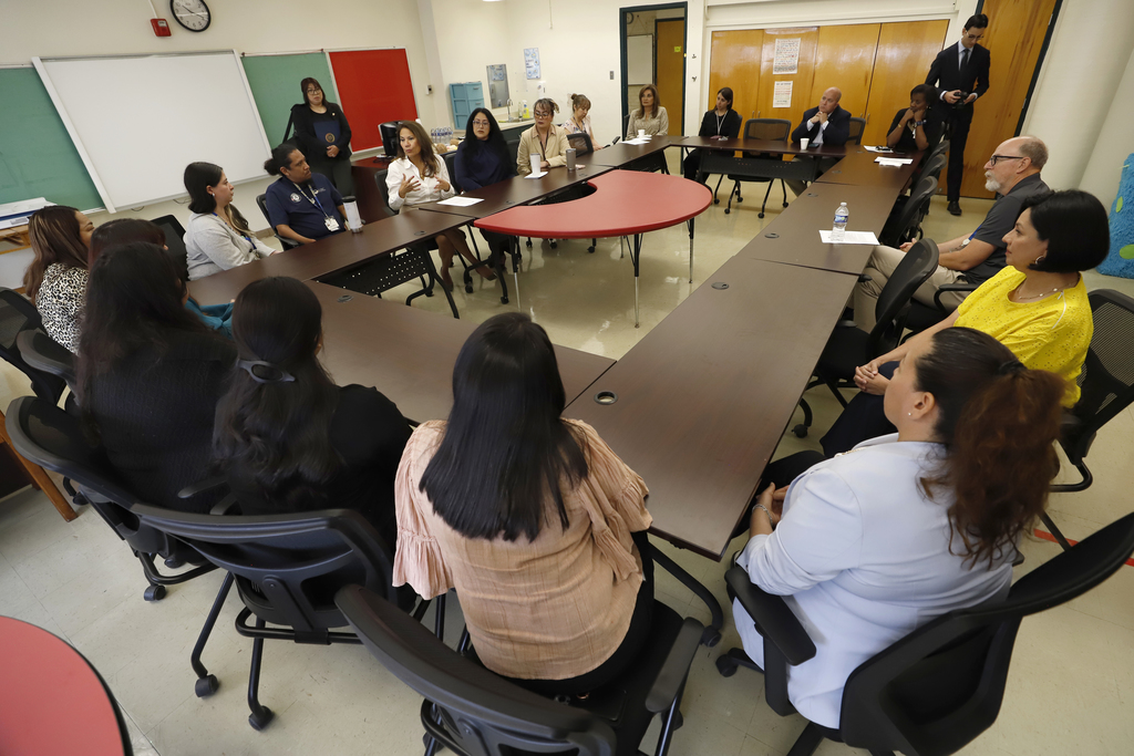 Congresswoman Veronica Escobar, El Paso ISD Community Schools program staff and other El Paso ISD staff members having a group discussion