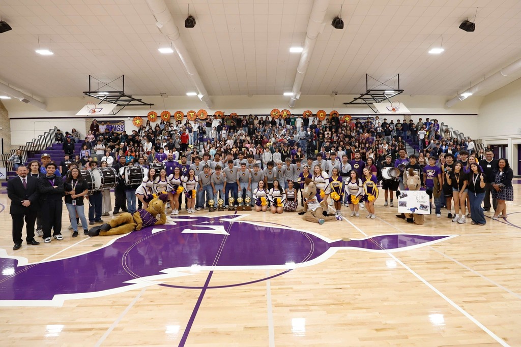 Burges High School soccer team takes group photo with other Burges students and staff during a pep rally celebrating the team heading out to the Final Four State Playoffs