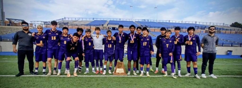 Burges High School varsity boys soccer team takes group photo with bronze trophy and medals
