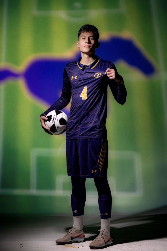 Photo of Christian Quintana, Burges soccer holding soccer ball