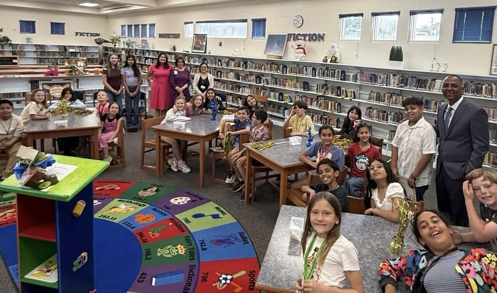 Mayor Renard Johnson takes group photo with Team of Excellence Award winner Nicolas Ontiveros Arrieta and Mesita staff and students