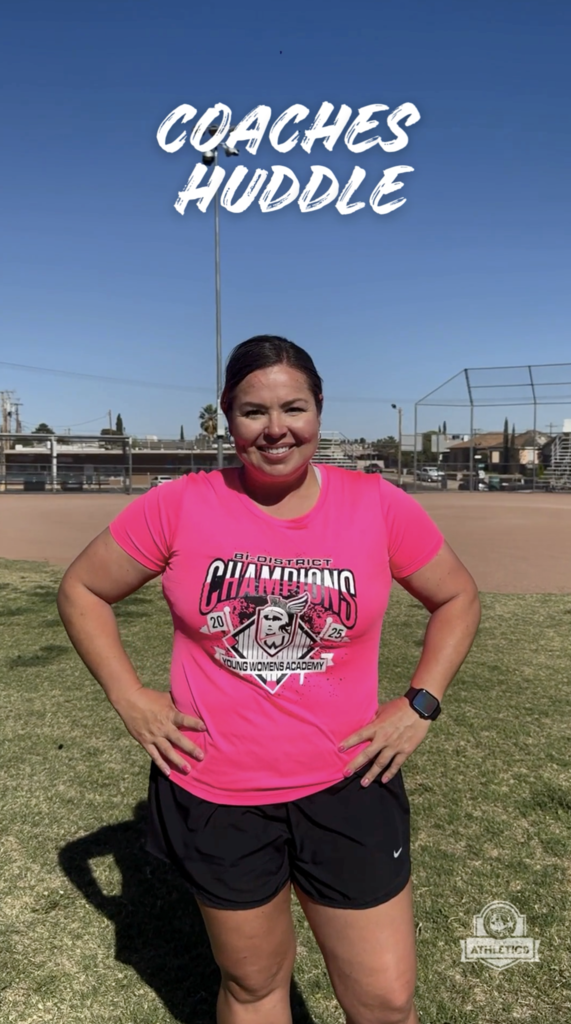 Young Women's Academy softball coach smilies for a photo with text on screen that says Coaches Huddle