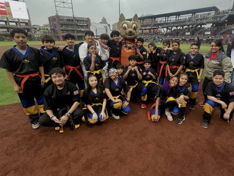 Bobby Joe Hill PK8 Kickstart kids take a group photo at the El Paso Chihuahuas game with mascot Chico