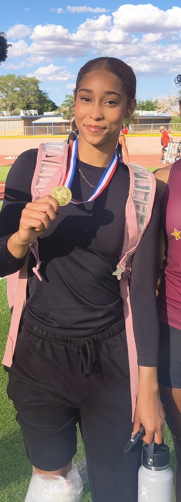Photo of Gianna Gulley, Andress track and field holding medal