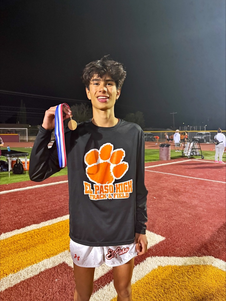 Photo of El Paso High track and field holding medal