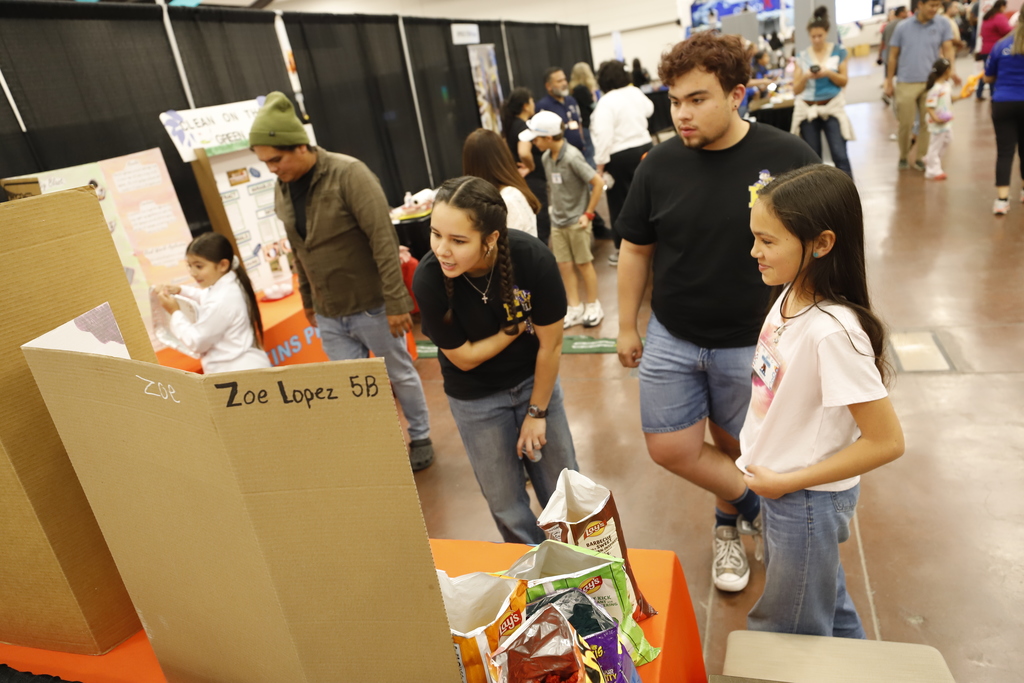 Don Haskins student presents project to two community members