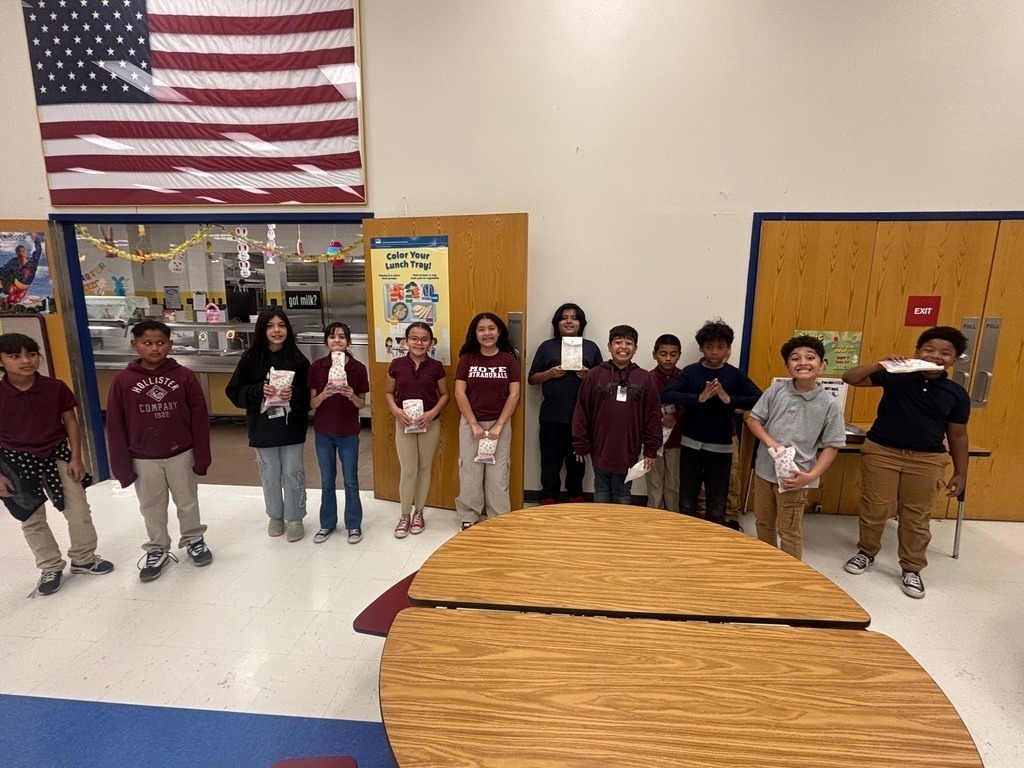 Students smiling with popcorn