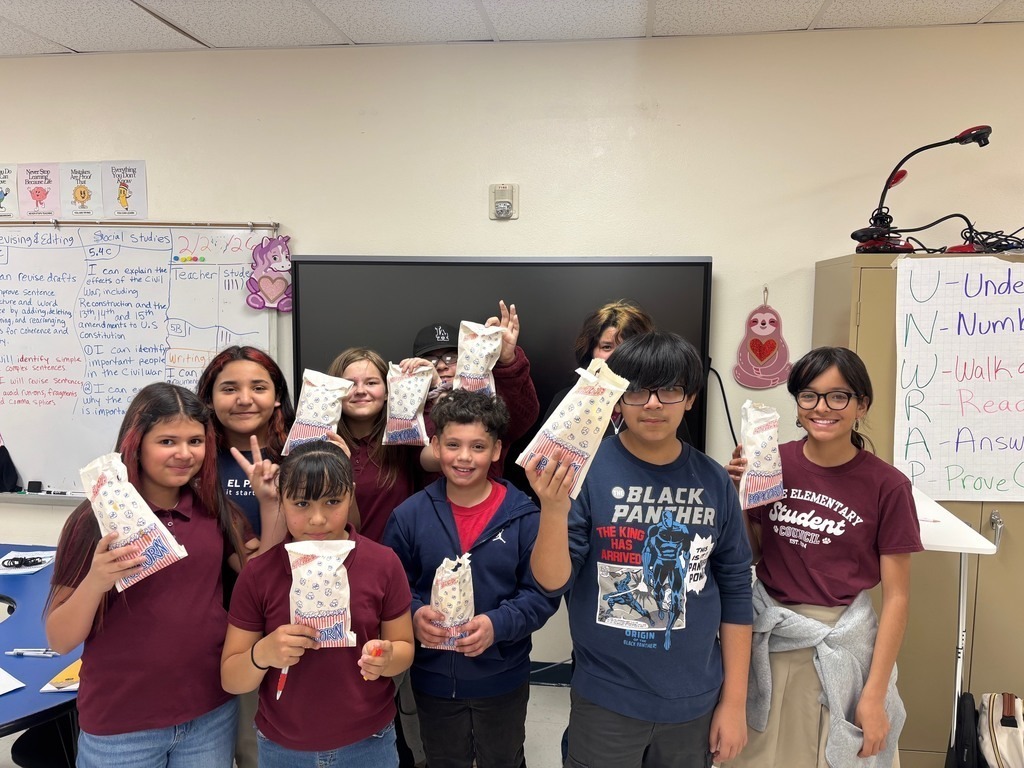 Students smiling with popcorn