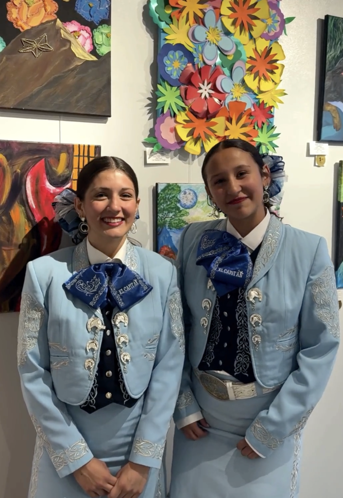 Two Chapin mariachi students smiling