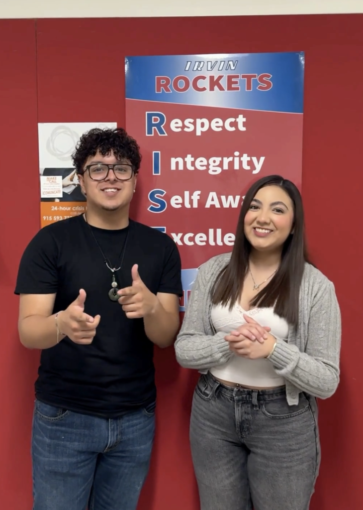 Two high school students smiling