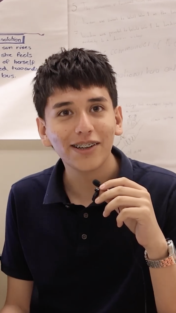 Photo of El Paso High School student speaking into tiny mic