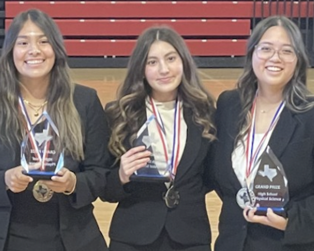 Photo of Franklin High School students Mia Olivas, Ivanna Aragon, and Abigail Caguingin smile with trophies and medals