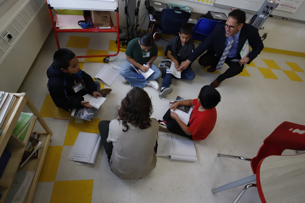 Superintendent Dr. Brian Lusk helping students with an assignment