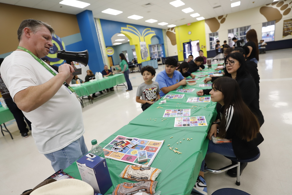 Guillen Middle School students and families playing loteria