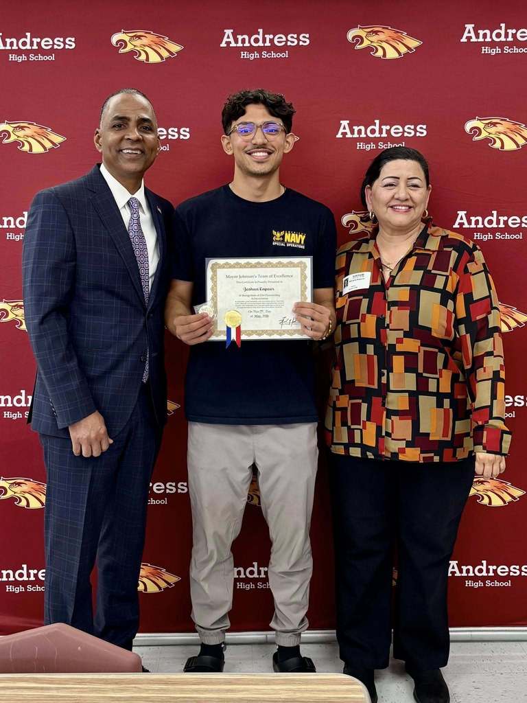 ayor Renard Johnson takes photos with Andress High School's Joshua Kapoor after he receives the Team of Excellence Award