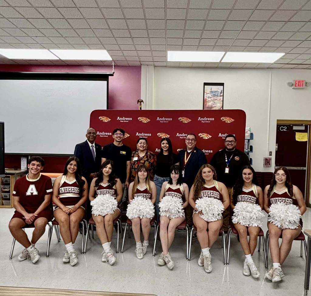 ayor Renard Johnson takes photos with Andress High School's Joshua Kapoor, cheerleaders, staff, and Principal after he receives the Team of Excellence Award