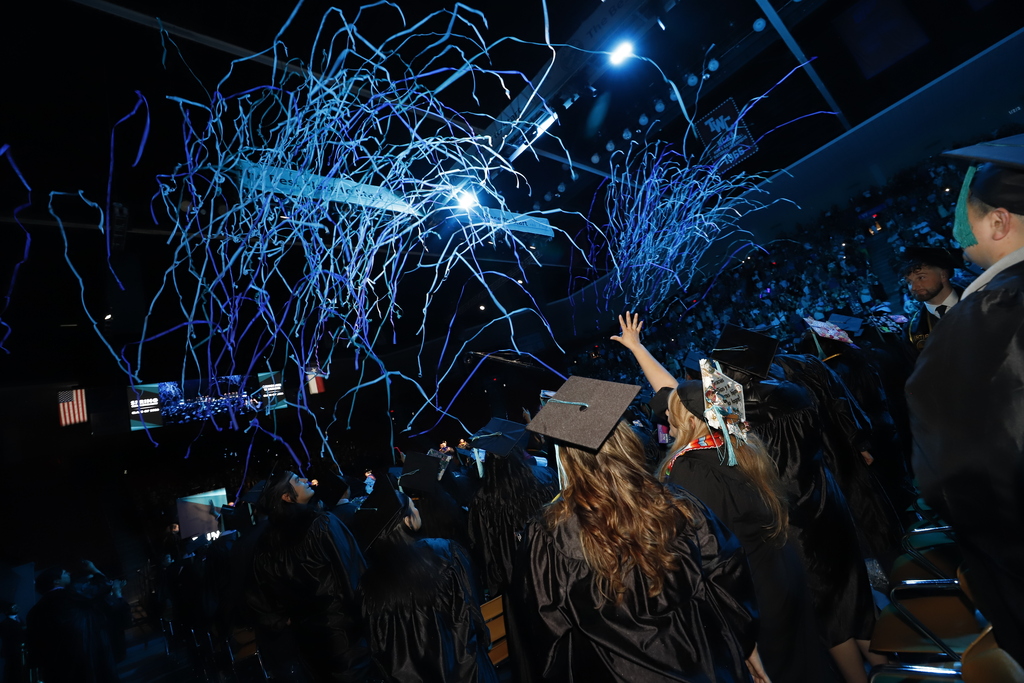 Graduates cheer as confetti falls onto them at the EPCC Spring 2026 Graduation