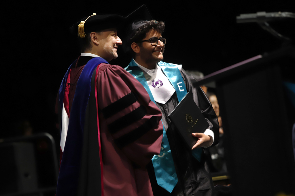 Franklin High School P-TECH program student takes photo with EPCC President