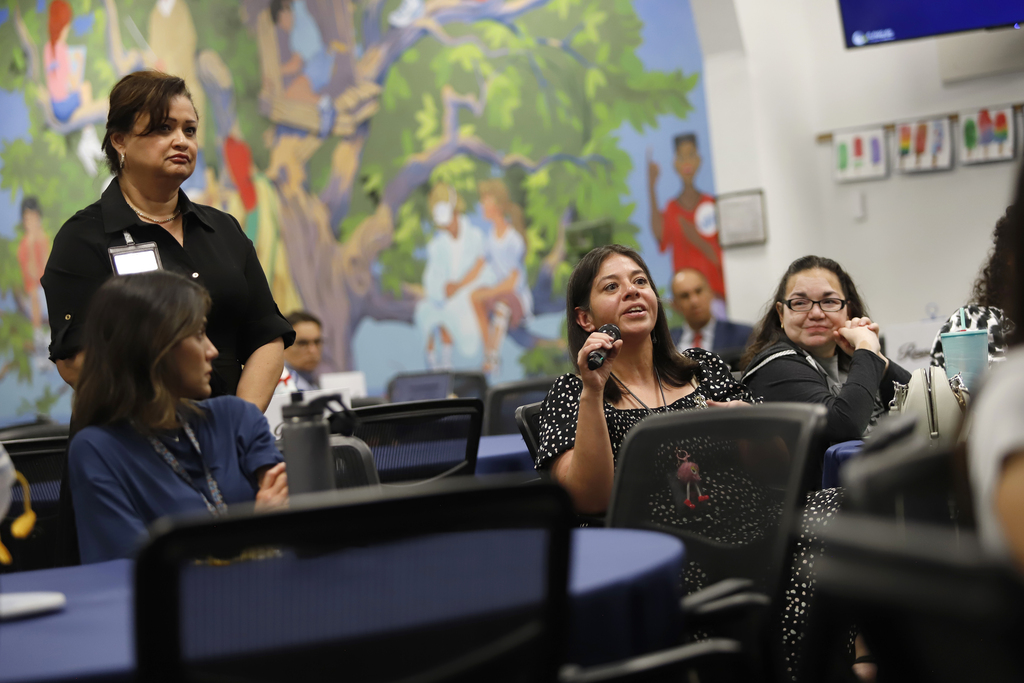 Superintendent Teacher Advisory Council members asking a question
