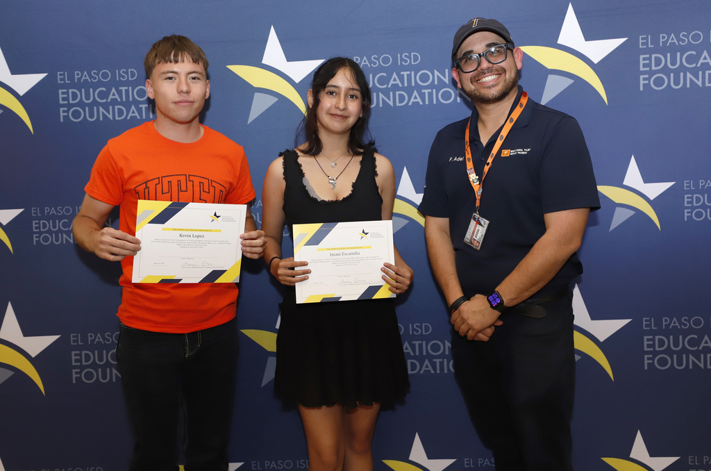 Bowie High School students take group photo with staff member during El Paso ISD Education Foundation scholarship ceremony