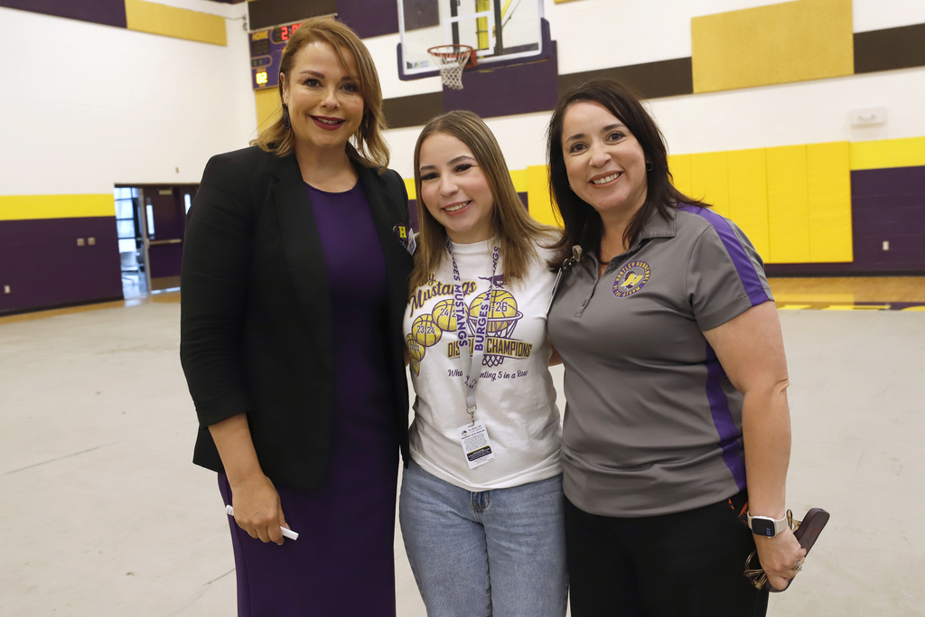 Hartley PK-8 Principal and Burges staff and student take a group photo