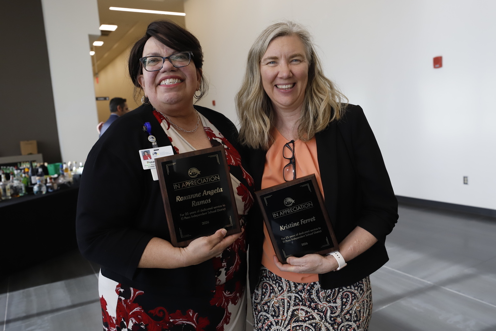 Staff members take photo with employee service awards