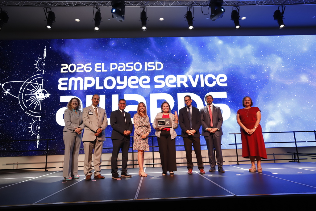El Paso ISD leadership staff, Superintendent Dr. Brian Lusk and Trustee Dr. Jack Loveridge take group photo with staff member celebrating 40 years of service
