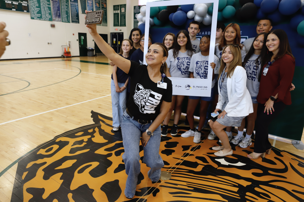 Richardson Middle School students and staff smile in Right Here Right Now giant polaroid