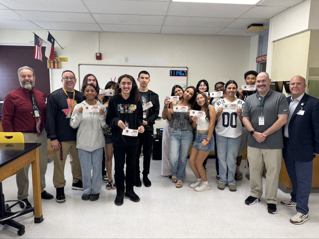Attendance Challenge Student and staff winnesr take photo with prize and education foundation manager Russel Booth