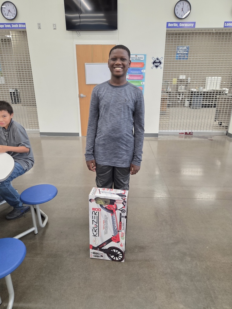 Attendance Challenge Student winner takes photo with prize 